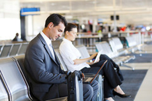 Man and Women Waiting at Airport Terminal